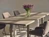 Custom made oak dining table with a modern geometric base, light grey finish, and a complimentary white trestle. 